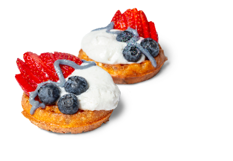 Berry Shortcake Waffles with coconut whip and strawberries and blueberries