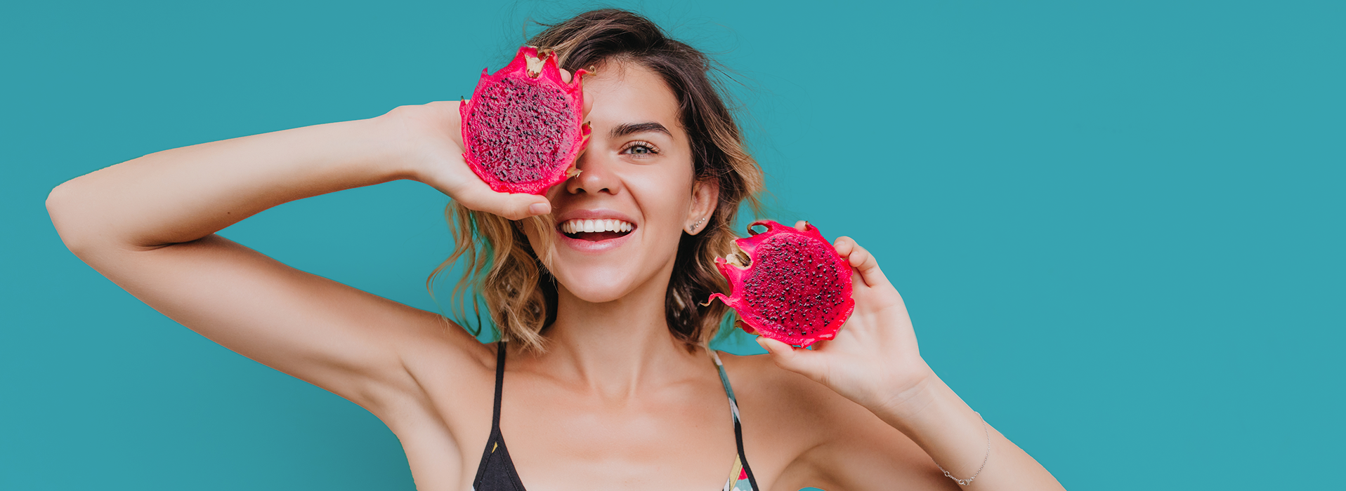Girl holding dragon fruit
