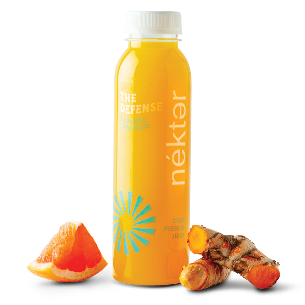 The Defense Juice shown with grapefruit and turmeric ingredients