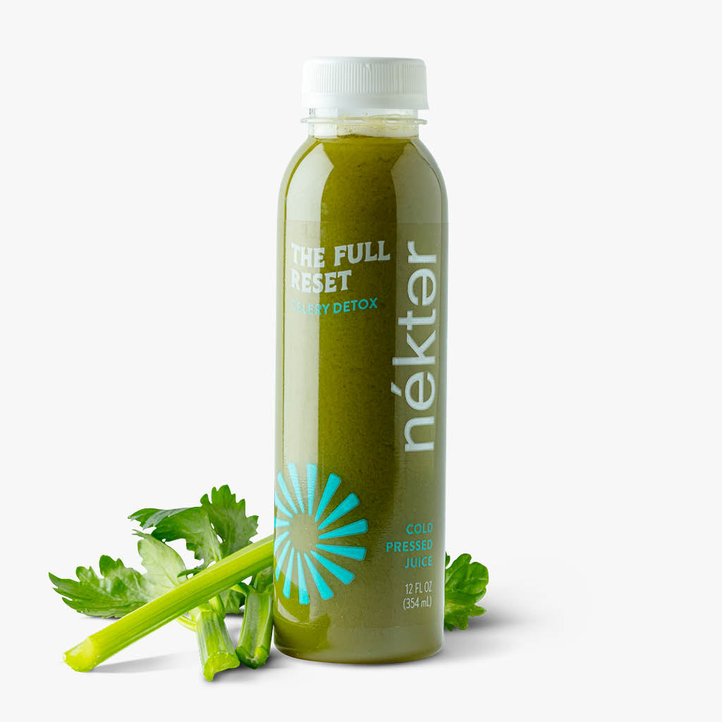 The Full Reset bottled juice shown with celery