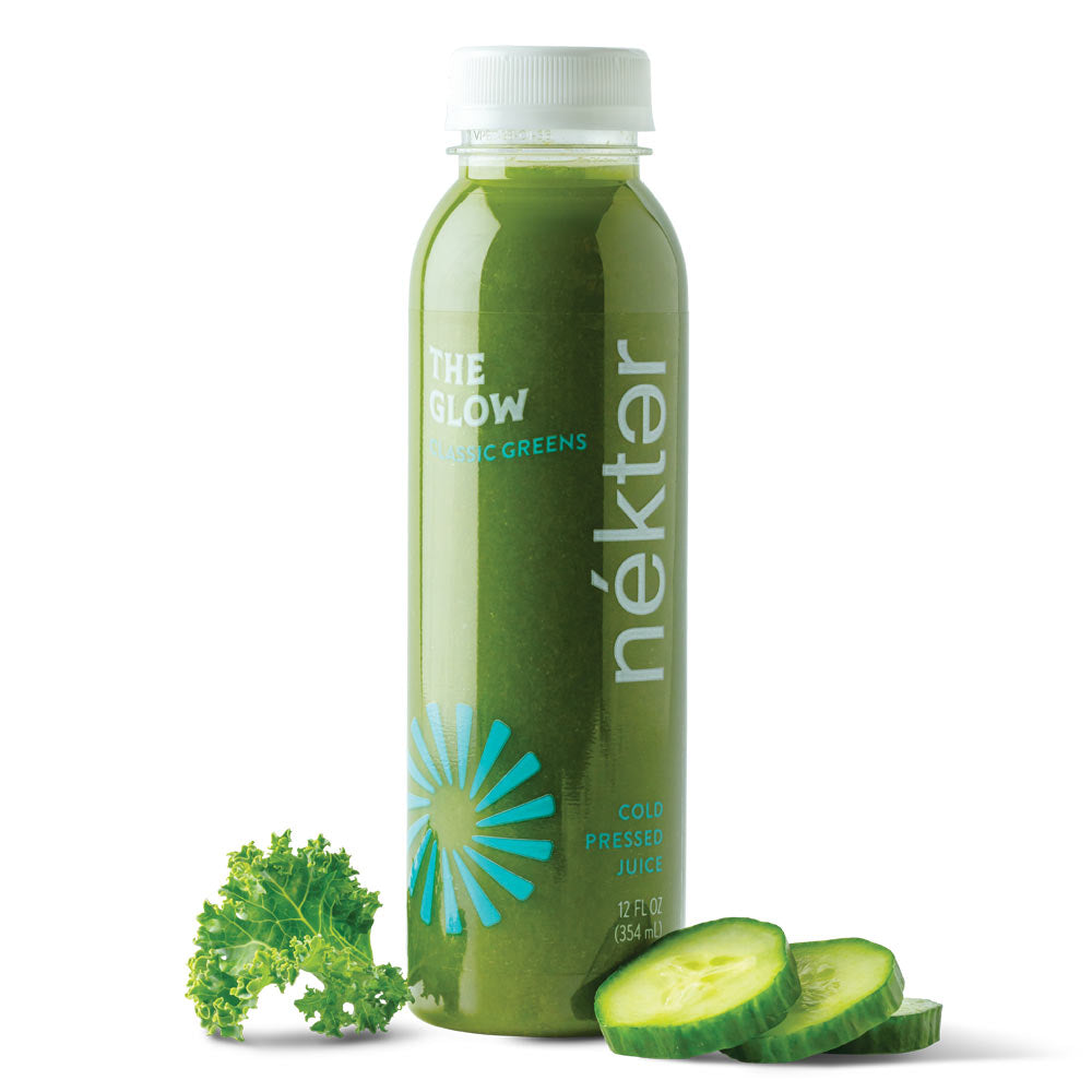 The Glow Bottled Juice shown with Kale and cucumber