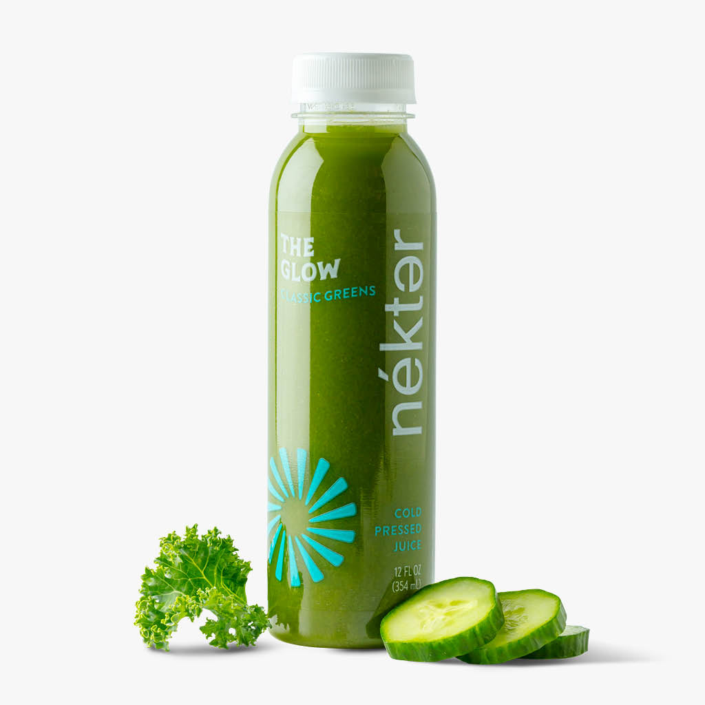 The Glow Bottled Juice shown with Kale and cucumber