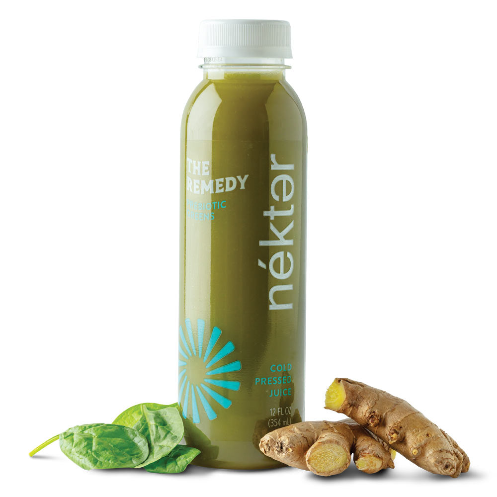 The remedy green juice shown with spinach and ginger.