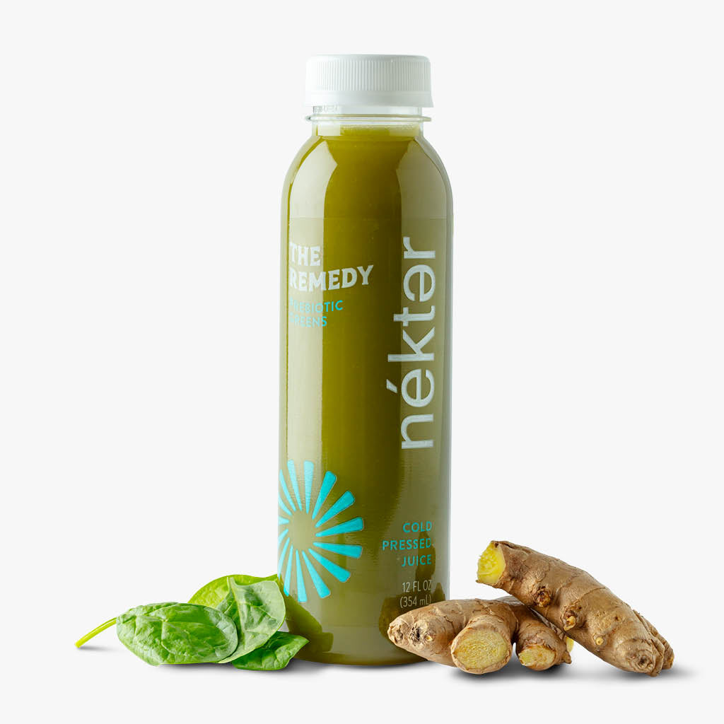 The remedy green juice shown with spinach and ginger.