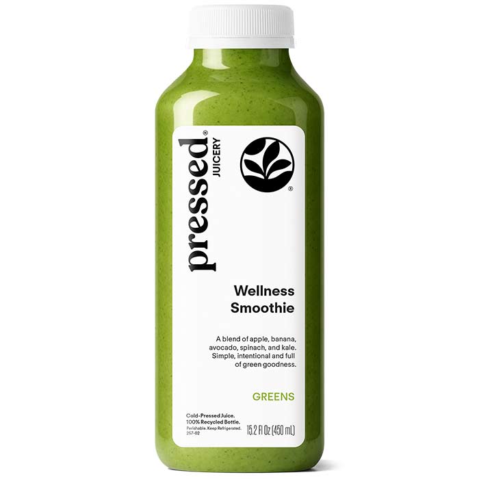 Green smoothie bottle labeled 'pressed Juicery Wellness Smoothie' on a white background