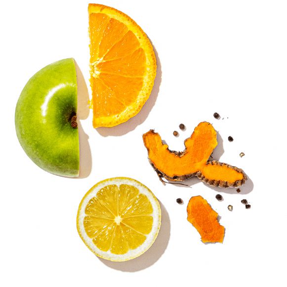 Fruits including an orange, lemon, and a piece of what appears to be a pumpkin on a white background.