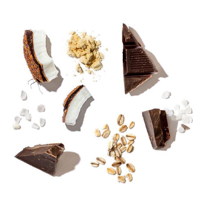 Assorted chocolate pieces, coconut, nuts, and marshmallows on a white background