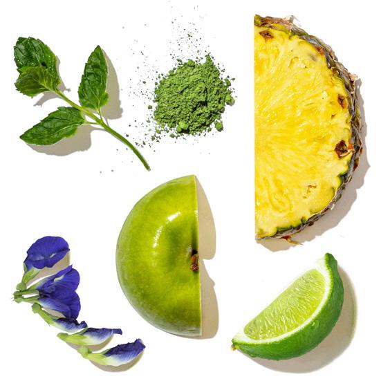 Collage of green fruits and vegetables including a pineapple, apple, lime, and mint leaves on a white background.