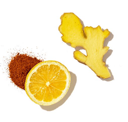 Ginger root, lemon, and cayenne pepper on a white background