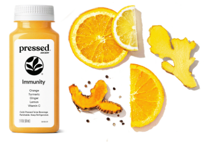 Vitamin supplement bottle labeled 'pressed' with sliced oranges on a white background