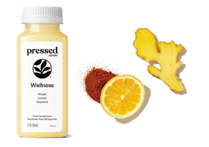 Bottle of 'pressed' Wellness Ginger Lemon Cayenne supplement with ginger root, lemon, and cayenne pepper on a white background.