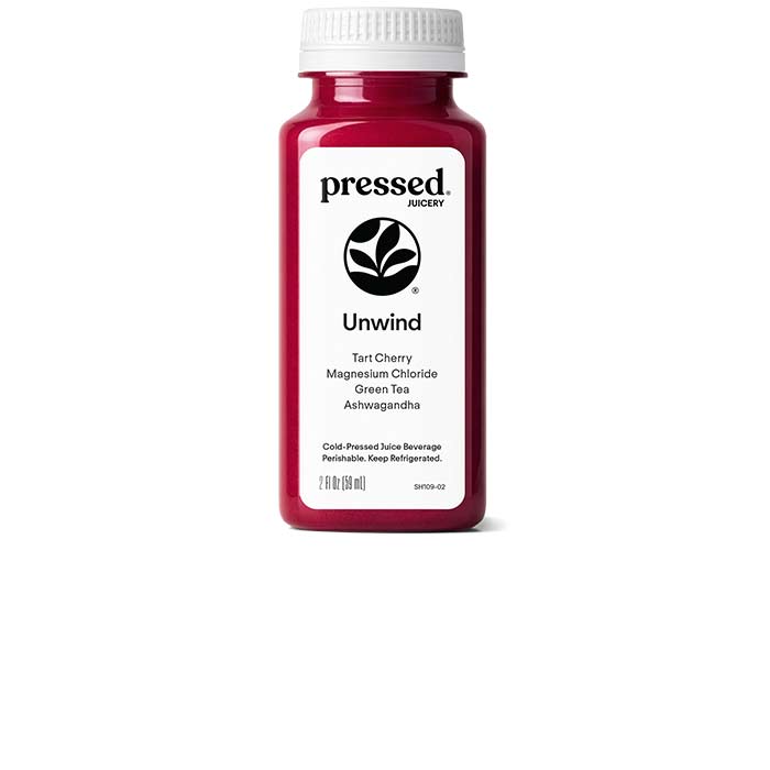 Bottle of Pressed Juicery 'Unwind' juice on a white background